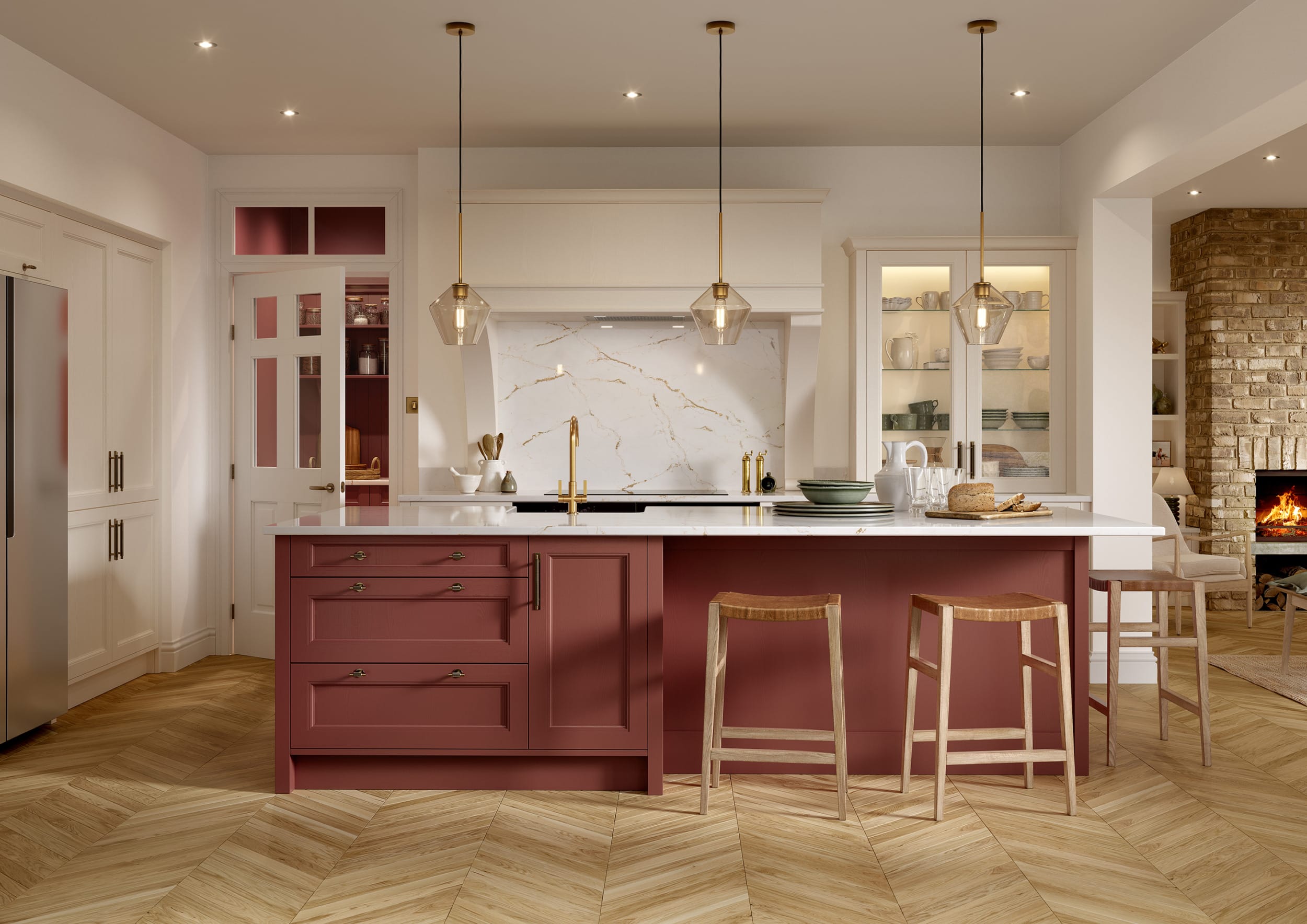 A refined kitchen with shell and antique red cabinets, central island, and elegant lighting, blending classic and modern styles.